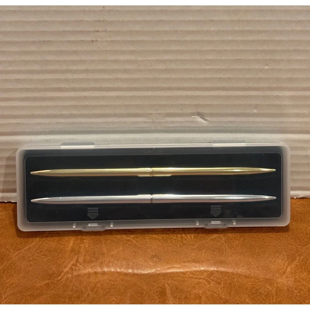 Vintage Slim Minimalist Metal Twist Pens 1 Gold and 1 Silver with storage case.
